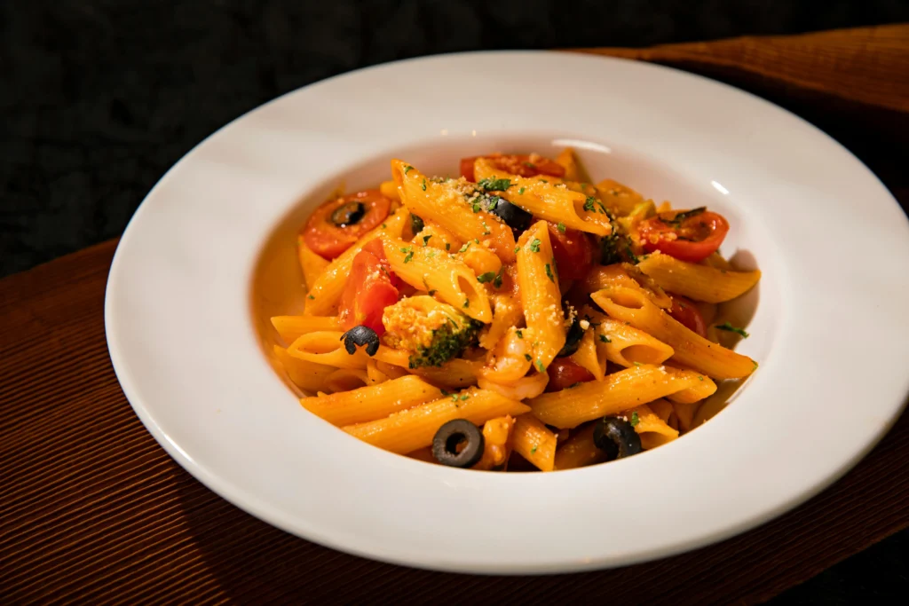 Freshly prepared Italian pasta served on a rustic plate, highlighting the art of making-How to make Italian pasta at home