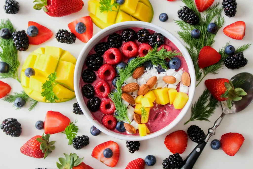 Vibrant Vegan Smoothie Bowl with Fresh Fruits, Nuts, and Superfoods – A Healthy and Delicious Plant-Based Breakfast.