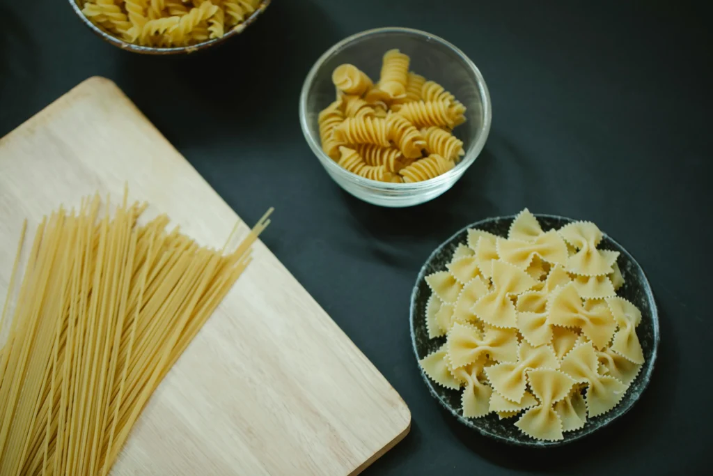 A steaming pot of boiling water with pasta perfectly cooked to al dente, showcasing the best way to cook pasta