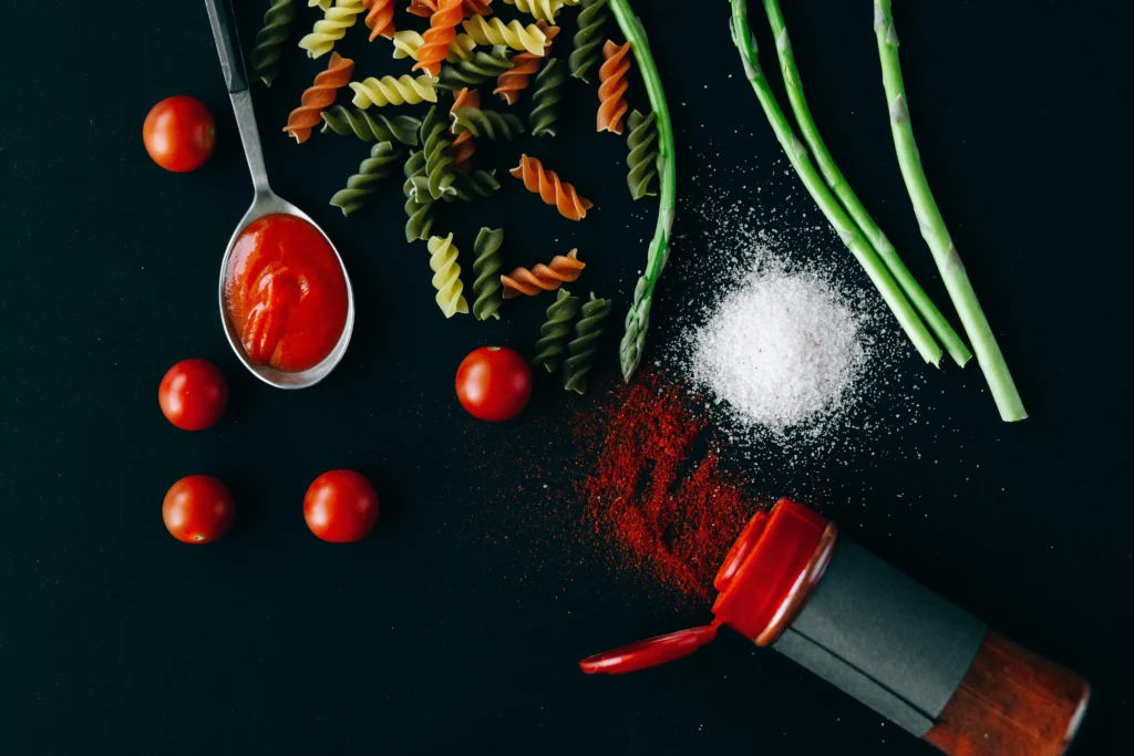 A close-up of a vibrant, homemade pasta dish with colorful sauce and garnishes, illustrating a delicious pasta recipe
