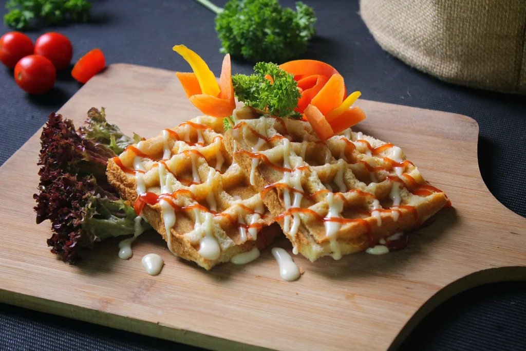 Crispy Waffle Sandwiches with Sweet Maple Drizzle and Savory Avocado Filling – A Must-Try Vegetarian Delight