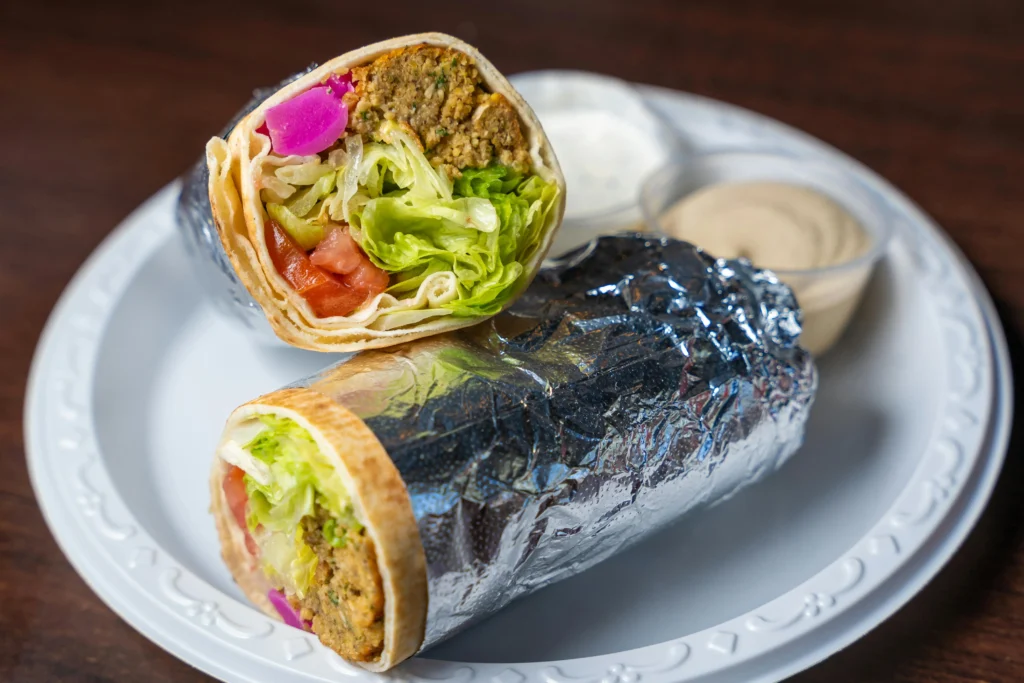 Crispy Fusion Falafel Wraps with Fresh Veggies and Sauces – A Must-Try Global Vegetarian Dish.