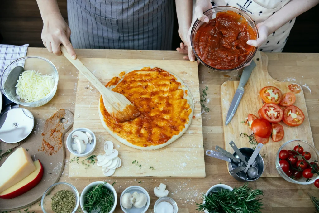 Freshly baked vegetarian pizza with a crispy, golden crust and vibrant toppings on a rustic wooden table.