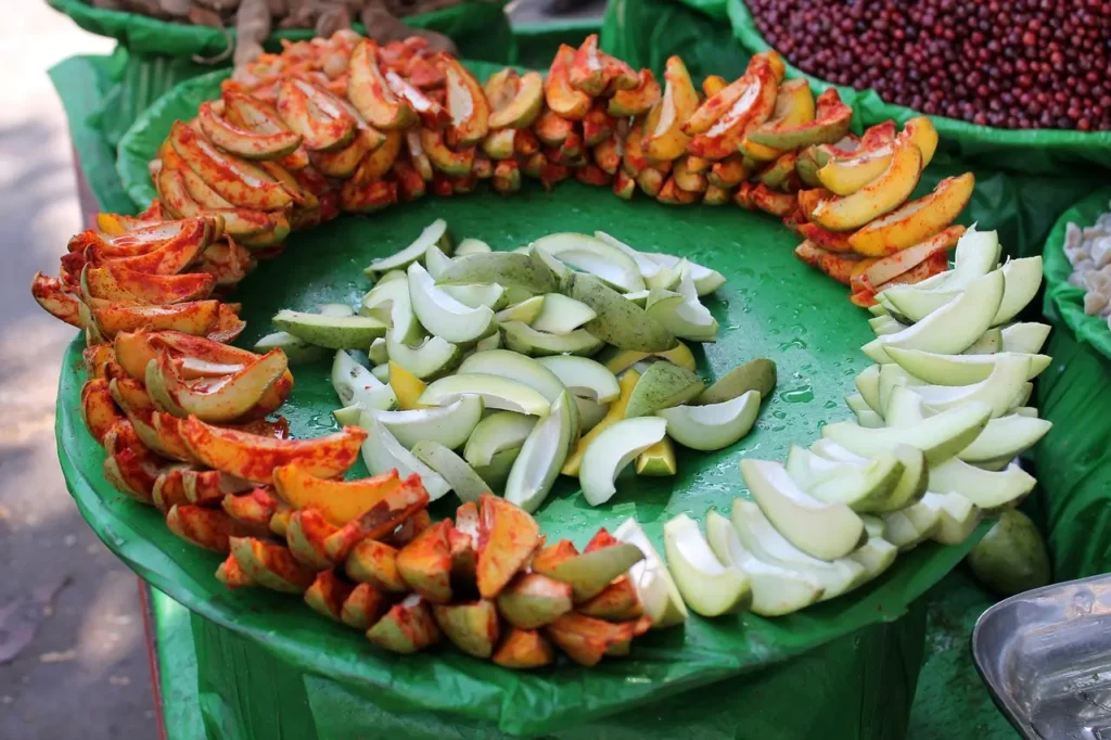 Crowd enjoying plant-based street food at an urban market with eco-friendly vibes