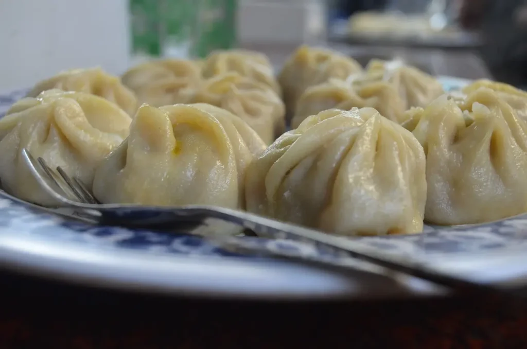 Steamed vegan dumplings and plant-based dim sum served with soy dipping sauce